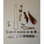 Two coin bracelets; a filigree bow bracelet; a small paste set silver lizard brooch; a Victorian