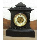 A Victorian mantel clock having cream enamel chapter ring and recessed dial centre, two train