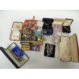A quantity of assorted costume jewellery including paste set brooches; pendants' earrings; faux