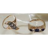 A 9ct gold dress ring, set with three blue topaz stones and spaced with clear stones, size N+ (A/F);