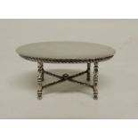 A 19th Century Continental miniature silver oval centre table having plain top, gadroon frieze and