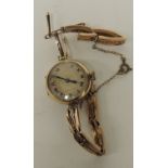 An early 20th Century ladies 9ct rose gold wrist watch with circular silvered metal dial on