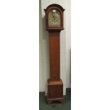 An early 20th Century grandmother clock having three train movement, arch brass dial with