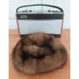 A Roberts radio and a ladies fur hat.