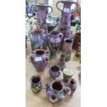 A large purple glaze Torquayware two handled vase decorate with a songbird, together with other