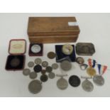 A silver metal snuff box; WWII medals; commemorative coins and other items