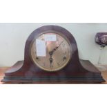 A wooden cased mantle clock.