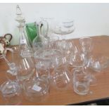 A green glass jug together with assorted items of clear, cut and engraved glass, etc.