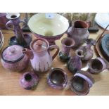 A selection of lilac glazed Torquayware with a pattern of heather, to include a candlestick, jar and