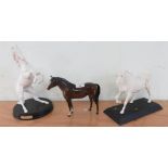 A Beswick figure of a standing bay horse; a Beswick figure 'Spirit of Freedom' with base; and a