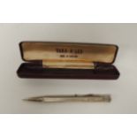 A silver cased Yard O Lead propelling pencil, the case with guilloche decoration, London 1967, in