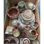 A collection of mottoware to include bowls, plates, cups, etc.