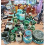 A quantity of green glazed pottery including vases and jugs, some items Torquay pottery.