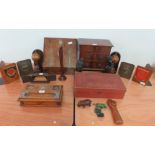 A wooden stationary box/writing slope with brass decoration, a miniature chest of drawers, bookends,