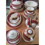 A Crown Ducal part dinner service and a Meakin part dinner service, both decorated in burgundy and