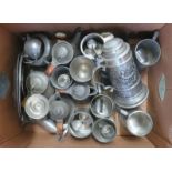 Six metal tankards, a Stein, two metal plates and other metalware.