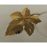 A 9ct gold brooch in the form of a maple leaf. 3.4g approx