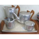 A Picquotware teapot, hot water pot, milk jug and sugar bowl together with associated tray.