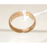 A large 18ct gold wedding band, size U, 6.7g approx.