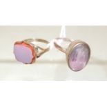 A 9ct gold dress ring set with an oval, faceted mauve glass stone, size L; and another gold (tested)
