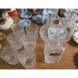 Three heavy cut glass decanters with spirit labels and six heavy cut glass tumblers.