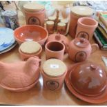 A 'Mr Brannam's....Devon Terracotta' flour storage jar, together with other items by the same maker;