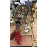 A decorated brass shell casing, metal candlesticks, assorted cutlery, etc.