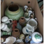 A large squat green glazed pottery vase, bird figurines, etc.