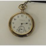 An Elgin open face keyless pocket watch in gold plated case having white enamel dial with subsidiary