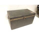 A small travelling trunk with original printed paper lining, studded black canvas covering with