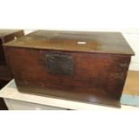 A 19th century oak storage box with metal lock plate and contents, 61cm wide, 39cm deep