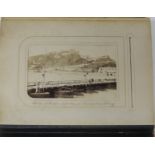 A small Victorian album of approx 44 carte de visite style photographic souvenir cards, views of