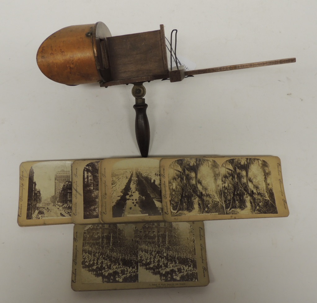 A Victorian hand held stereo viewer together with a number of Excelsior Stereoscopic Tours cards