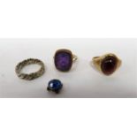 Two 9ct gold rings, one set with a large purple stone, the other set with deep red stone, a silver