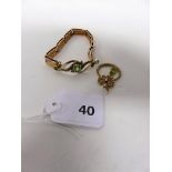 A rose gold bracelet 9ct, set with a central panel curve of peridot stone and pearls, weight