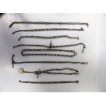 A collection of eight silver watch/fob chains and curb link necklace, weight approx 7.9 troy oz,