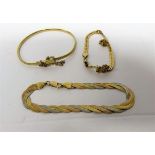 Three gold bracelets to include, a tri-coloured bracelet stamped 750 and two snake chain bracelets