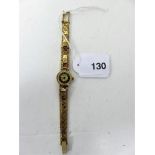 A ladies seventeen jewel sekonda wristwatch, the strap of unmarked gold engine turned squares and