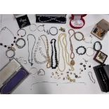 A collection of costume jewellery to include unmarked gold earrings, an unmarked gold ring set