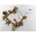 A 9ct gold charm bracelet, weight approx 31g.