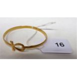 An 18ct gold (tested) Eqyptian Ankh bangle, weight approx 11.8g.