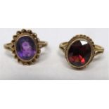 Two 9ct gold rings, one set with a large red oval stone and another set with a large purple oval