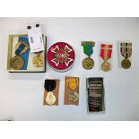 A mixed collection of medals, to include a 1902 coronation medal, a safe driving medal, and others