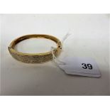 A gold diamond pave bangle in the Art Deco style, stamped 750, weight approx 30.7g