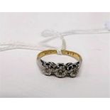 An 18ct gold and diamond ring, three diamonds set in platinum, marked 18ct, weight approx 2.8g.