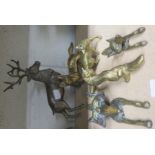 Three brass foxes, together with two brass fox door knockers and a brass stag