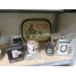 Collection of guinness items to include a tray, a jug, two mugs, a clock, a goblet, an alarm