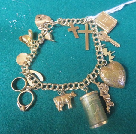 A marked 9ct gold charm bracelet, with some charms marked 9ct, length 18cm, gross weight 26.5g