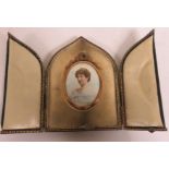 Oval portrait miniature of lady wearing a white dress, in gilt frame, 5.5cm x 4cm, in leather case