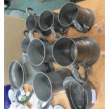 Nine pewter mugs